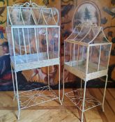 Amended image - Victorian style greenhouse painted green metal raised on four legs with