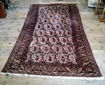 A large early 20th century hand knotted Middle Eastern / Caucasian rectangular carpet, bold