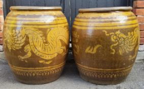 A pair of country house entrance planters,  the substantial planters with a dragon amongst the