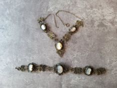 A 19th century silver filigree necklace and bracelet suite set with cameo intaglio