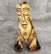 Amended Description an African leg bone carving, 15cm high