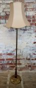 An early 20th century toleware and gilt metal mounted standard lamp, weighted base, with shade 155cm