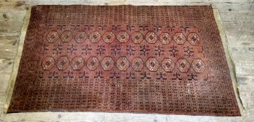 A 19th century Afghan Ersari Fil Pai rug with classic geometric patterned border with central