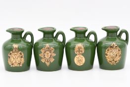 Twenty four assorted Rutherford's white ceramic decanters, military series