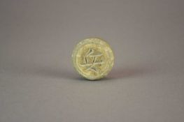 A Chinese Longquan celadon xiangqi chess piece, possibly Song Dynasty