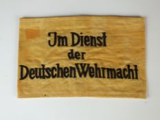A German WW2 'Im Dienst Der Deutschen Wehrmacht' Armband. worn by non-military & non-German