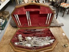 Harlequin set of community plated cutlery in a shaped walnut canteen.