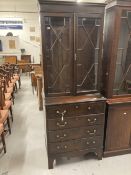 Late 19th cent. Slender mahogany glazed bookcase over four drawer chest, on bracket supports. 30ins.