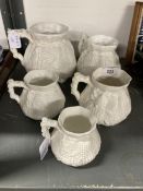 Late 19th/Early 20th cent. Ceramics: Five white porcelain graduated cider jugs, unsigned but with