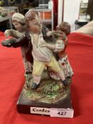 Early 19th cent. English pearlware group 'The Contest' on brown base, possibly Dudson. 6¾ins. x 3¾