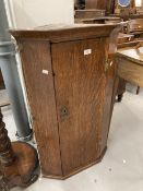 Oak corner cupboard.