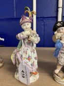 Meissen figures, young girl carrying a toy lamb decorated in coloured enamels, crossed swords to