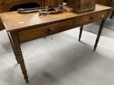 19th cent. Mahogany two drawer side table on turned ring legs. 48ins. x 16ins. x 27¾ins.