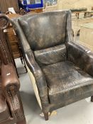 Andrew Martin Harrow style leather and fabric high back armchair.
