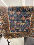 Carpets & Rugs: Caucasian, possibly Kazak, rug. Blue ground with geometric designs and six borders