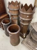Late 19th cent. Glazed pottery chimney pots, a pair of crown top pots and two others.
