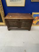 18th cent. Small oak six panel coffer, carved floral decoration to front two panels on bracket