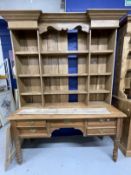 Early 20th cent. Pine knee hole table, five drawers, brass handles, on turned legs with a set of oak