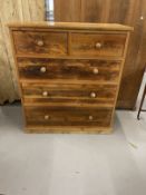 20th cent. Pitch pine two over three chest of drawers on plinth support. 44ins. x 19ins. x 49ins.