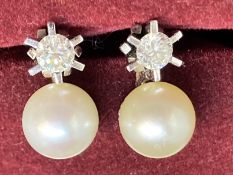 Jewellery: 18ct white gold earrings each set with a single brilliant cut diamond, estimated weight