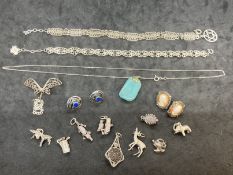 Jewellery: Collection of white metal jewellery to include charms, earrings, bracelets, etc. All test