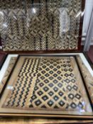 Textiles: Three framed and glazed carpet samples, possibly African. 31ins. x 19ins, 20ins. x