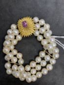 Bracelet triple row of sixty 7.5mm cultured pearls, twenty pearls per row with space bars having