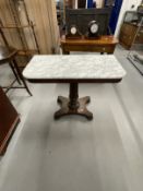 Early 19th cent. Rosewood marble topped side table on a turned column platform base on bun feet.