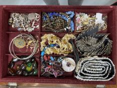 20th cent. Costume Jewellery: Brooches, bracelets, pendants, etc. In two opening display cases,