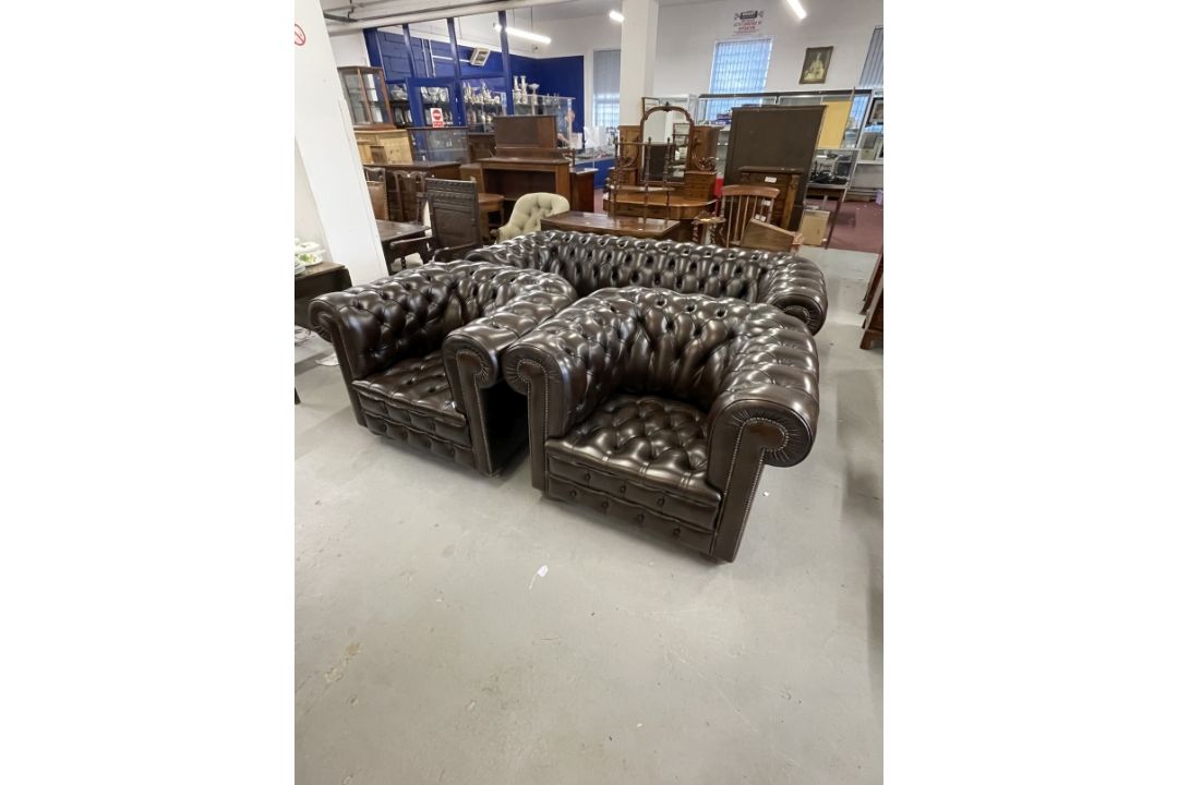 20th cent. Leather Chesterfield and matching pair of armchairs on bun feet. Settee length 80ins. - Image 1 of 3