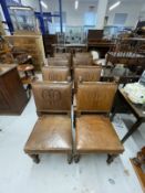 20th cent. Elizabethan style set of eight oak chairs with leather seats and monogrammed brass