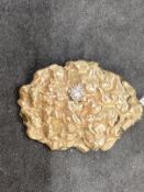Hallmarked Gold: Pendant in the form of a nugget set with a solitaire diamond. Hallmarked 375 9ct.