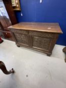 18th cent. Small oak six panel coffer, carved floral decoration to front two panels on bracket