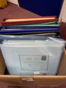 Postcards & Stamps: Four albums containing many covers and cards from all over the world with stamps