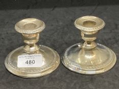 Hallmarked Silver: Pair of filled mantel candlesticks with key decoration, hallmarked Chester