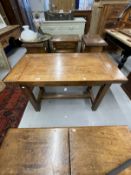 20th cent. Oak small plank top table with cleated ends on square legs joined by an H stretcher,