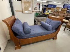 20th cent. Cherry wood sleigh end day bed bears makers label Simon Horn Furniture, London. 58ins.