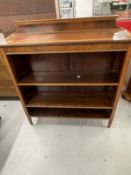 Edwardian mahogany open bookcase crossbanded with satinwood, two adjustable shelves raised on square