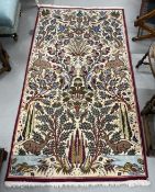 Carpets: 20th cent. Persian rug with animal and bird motifs. 79ins. x 42ins.