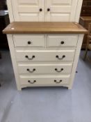 20th cent. Two door wardrobe with moulded oak cornice above two cream painted doors above a single