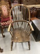 19th cent. Ash and elm farmhouse Windsor elbow chair, hooped back with continuous arm above,