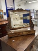 19th cent. Mahogany toilet mirror with carved shaped uprights on a concave two drawer base with