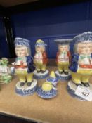 19th cent. English Staffordshire Toby figural condiments, each figure standing with a mug bordered