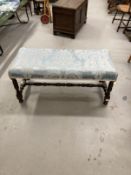 Early 20th cent. Footstool with turned legs joined by a turned stretcher. 40ins. x 18ins.