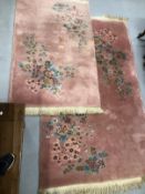 Carpets & Rugs: Chinese hand wash pink ground with blues, reds, greens and browns, a pair. 98ins.
