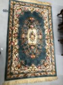 Carpets & Rugs: Chinese hand washed green ground with floral decoration in pinks, browns, greens and