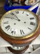 Clocks: Mahogany cased circular wall clock, spring movement, white painted dial, Roman numerals.