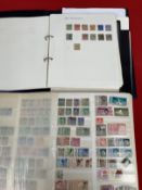 Stamps: Stockbook containing thousands of GB and World stamps mainly used. Plus a looseleaf album of