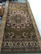 Rugs: Super Keshan green ground rug. Approx. 118ins. x 173ins.