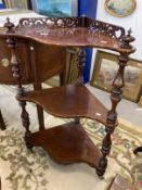19th cent. Mahogany corner three tier whatnot with pierced gallery, serpentine shaped shelves,